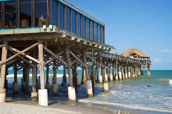 Cocoa Beach Pier which includes general coastal views and a sandy beach