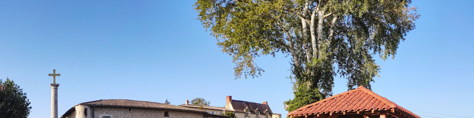 View of entrance of castle of Chonas-l'Amballan and historic wine press, Isere, France
