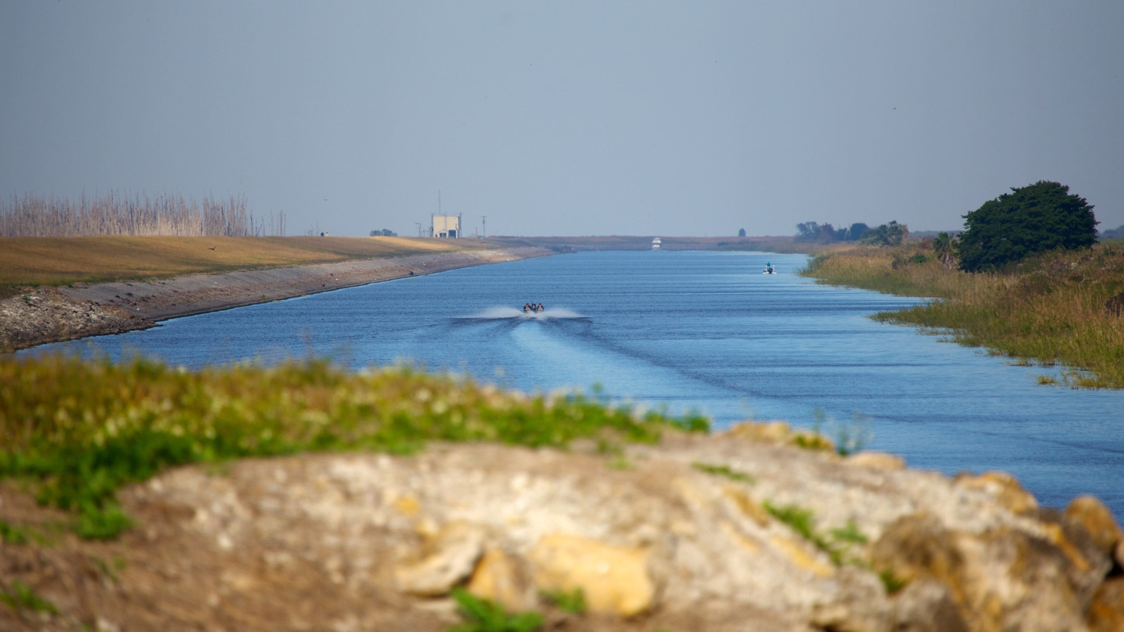 Lake Okeechobee showing a lake or waterhole and landscape views