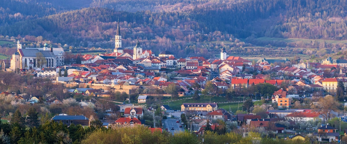 A town with a prominent church and a castle-like structure.