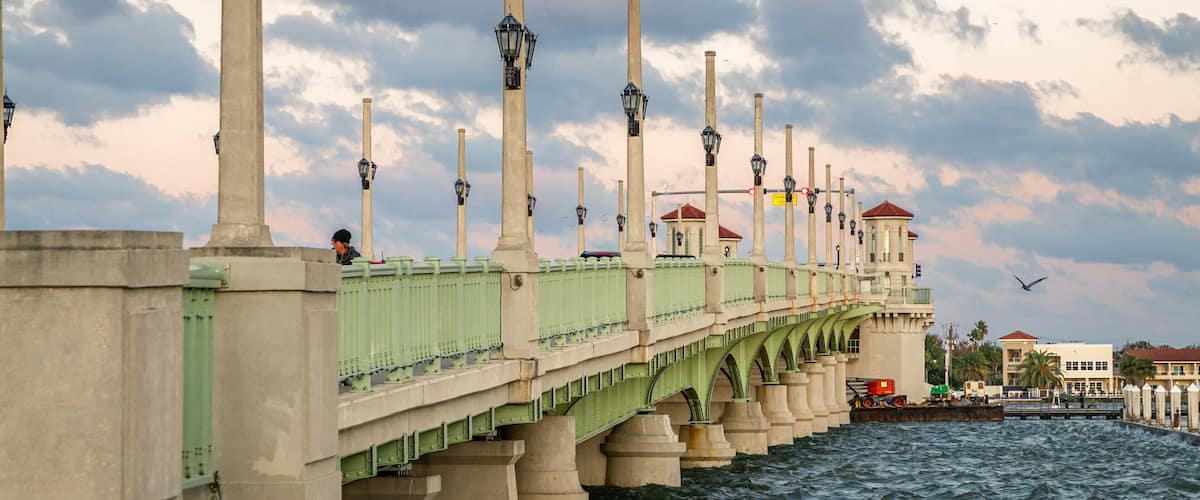 Bridge of Lions featuring a bridge, a sunset and a river or creek
