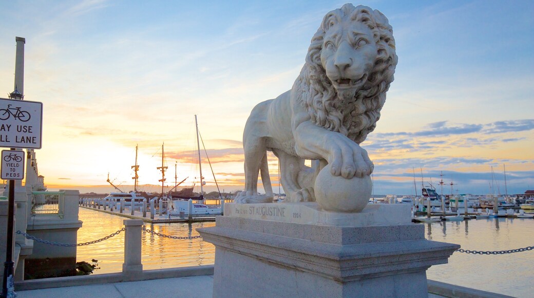 Bridge of Lions showing a statue or sculpture, general coastal views and a sunset