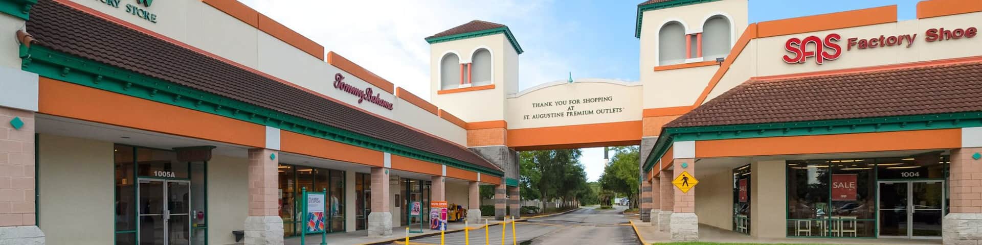 A shopping plaza with stores like J.Crew, Tommy Hilfiger, and SAS.
