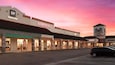St. Augustine Premium Outlets which includes signage, shopping and a sunset
