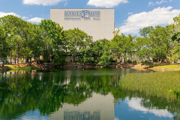 Barbara B Mann Hall featuring a pond