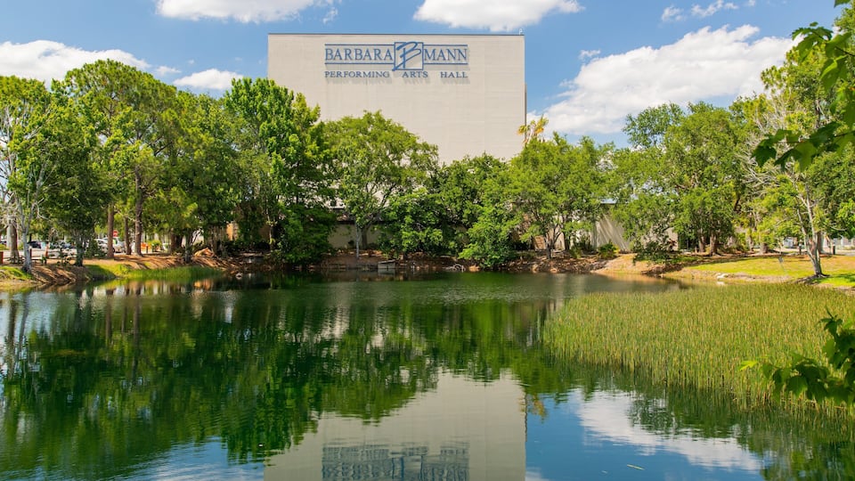 Barbara B Mann Hall featuring a pond