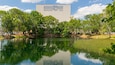 Barbara B Mann Hall featuring a pond