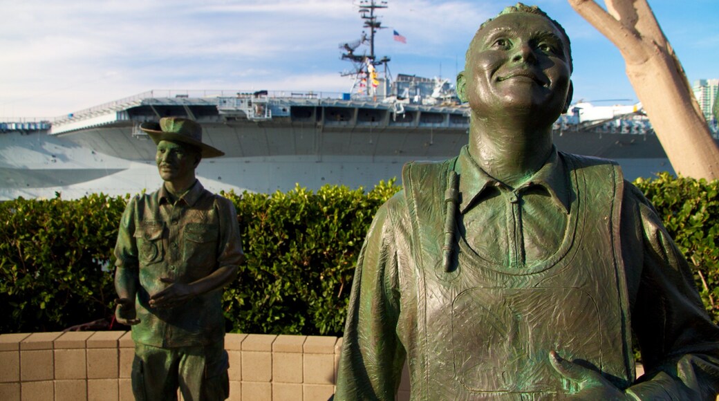 Navy Pier which includes a statue or sculpture, military items and a marina