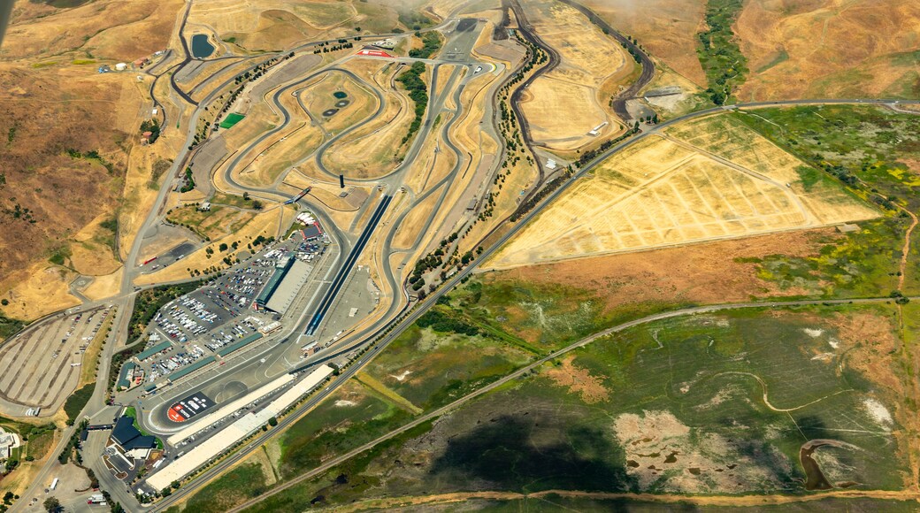 Aerial view of Sonoma Raceway in the golden grass fields and vinyards of wine country