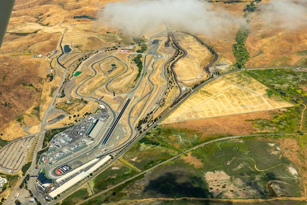 Aerial view of Sonoma Raceway in the golden grass fields and vinyards of wine country