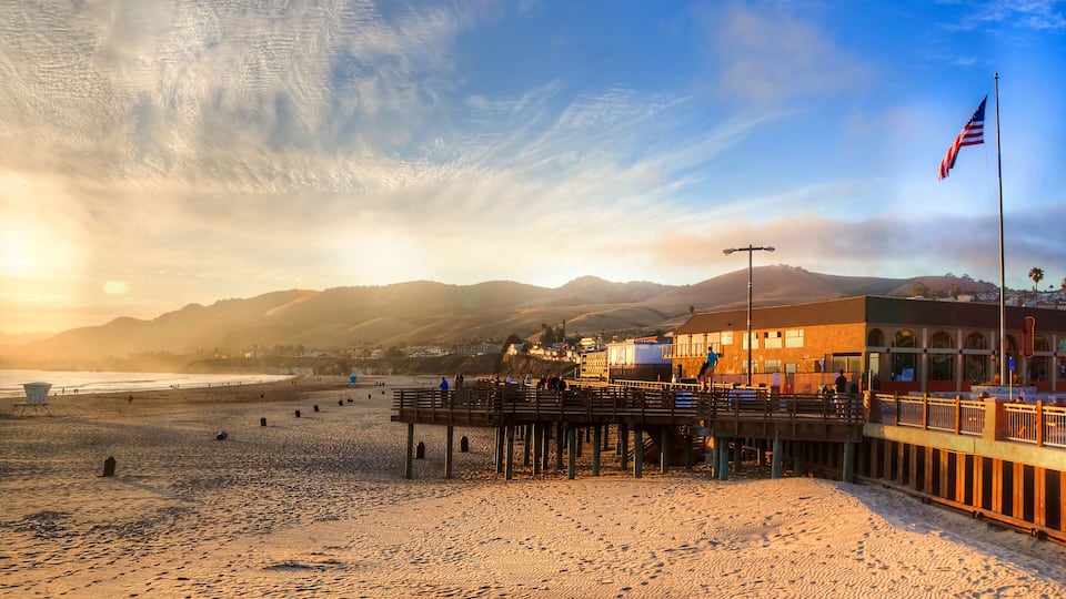 sun setting on Pismo beach pier