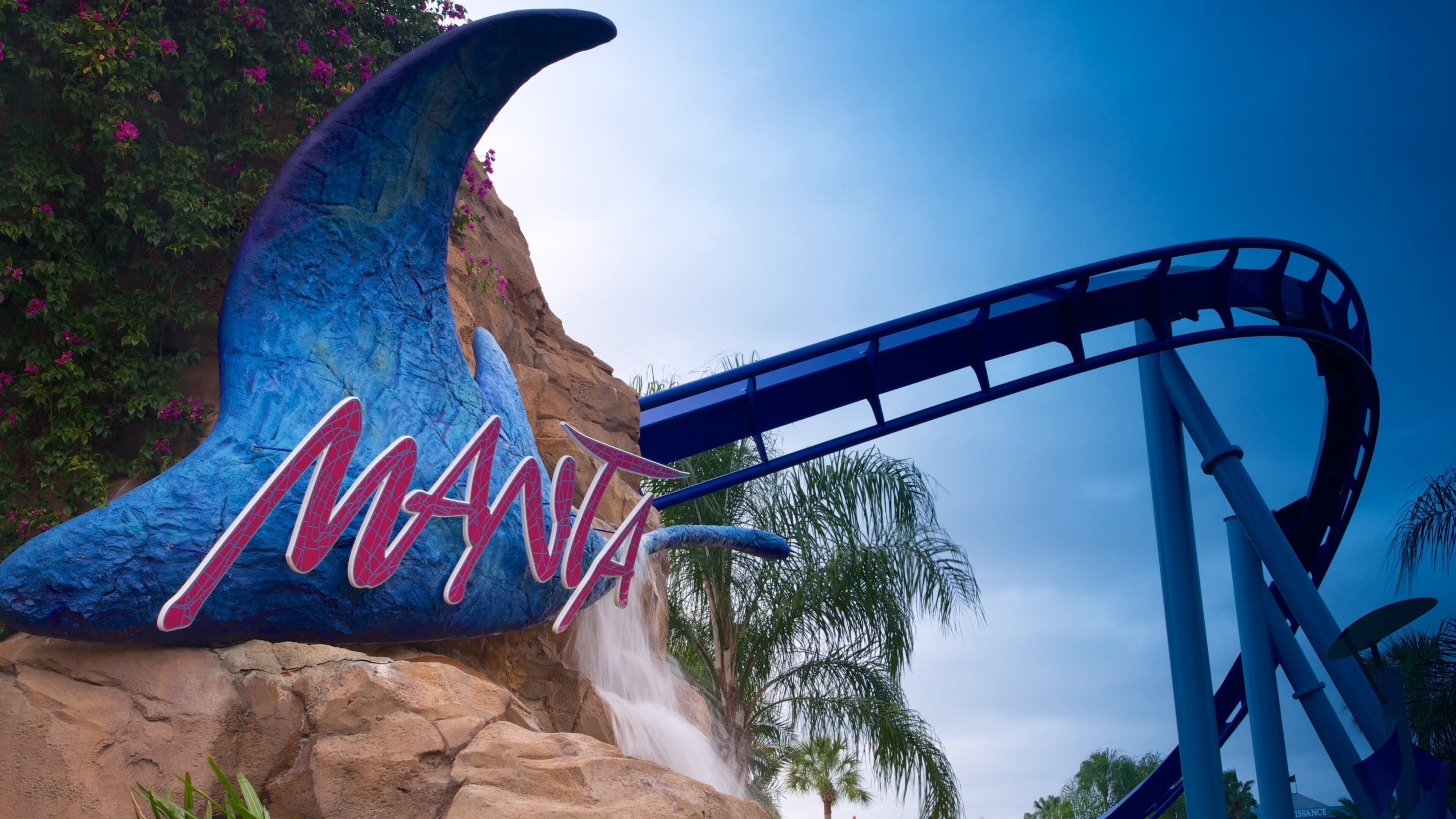 Exciting roller coaster at Aquatica in Orlando offers thrilling rides amidst lush landscapes