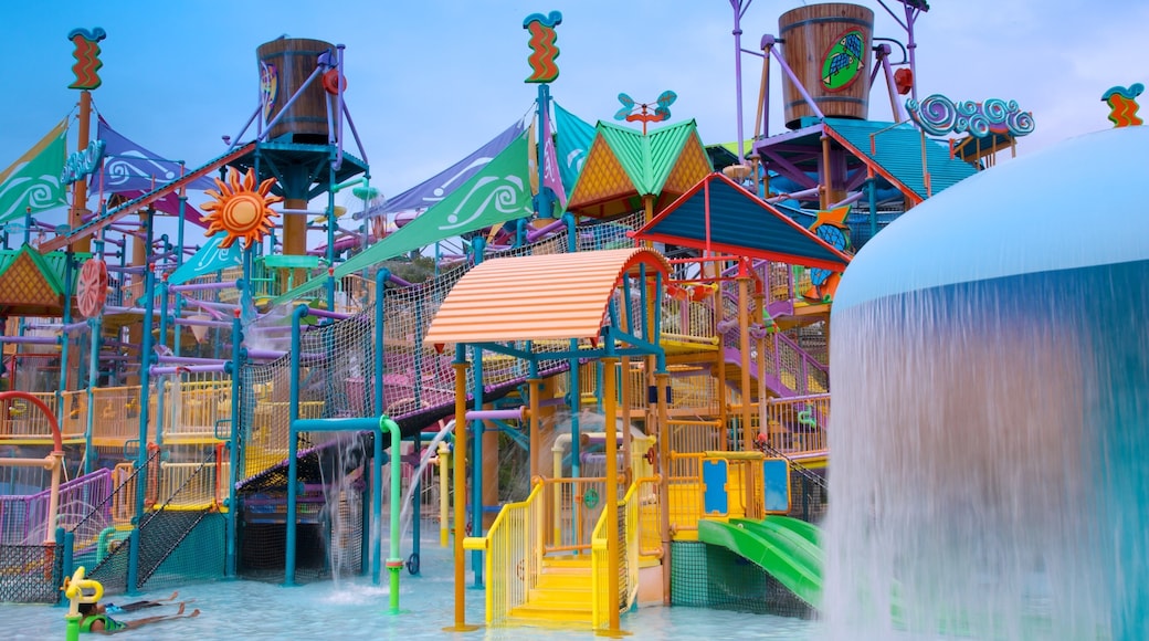 Exciting water attractions at Aquatica Orlando, showcasing colorful slides and play structures beneath a clear sky