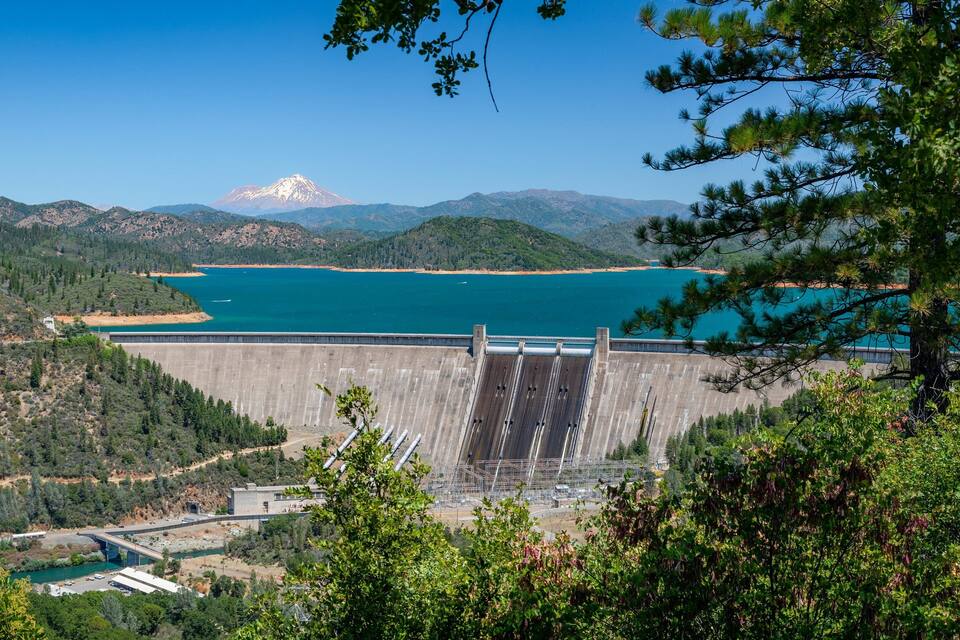 A dam, a lake, and a mountain.