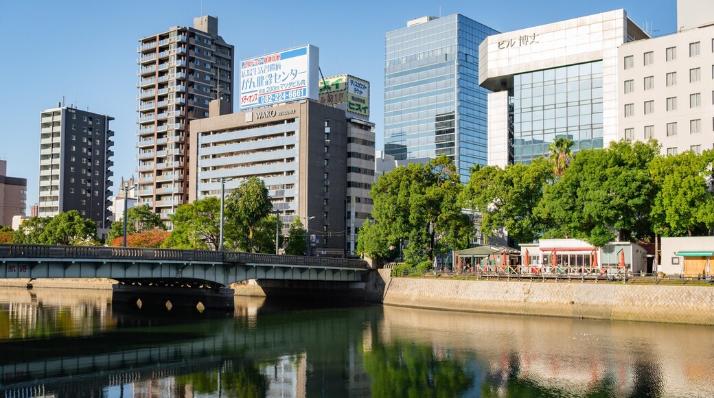 Hiroshima showing a city, a bridge and a river or creek