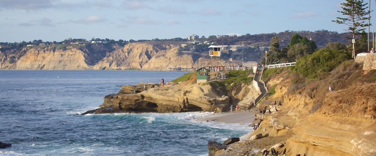 La Jolla Cove which includes rocky coastline and general coastal views