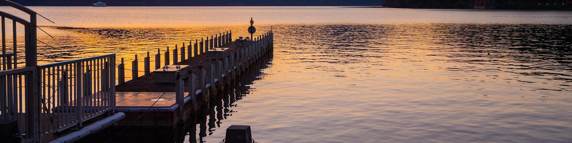 Hakone featuring a lake or waterhole and a sunset