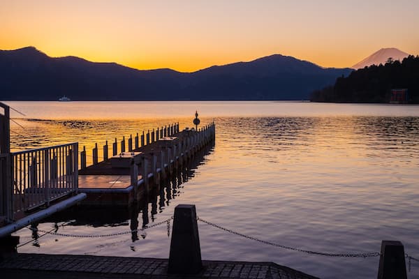 Hakone featuring a lake or waterhole and a sunset