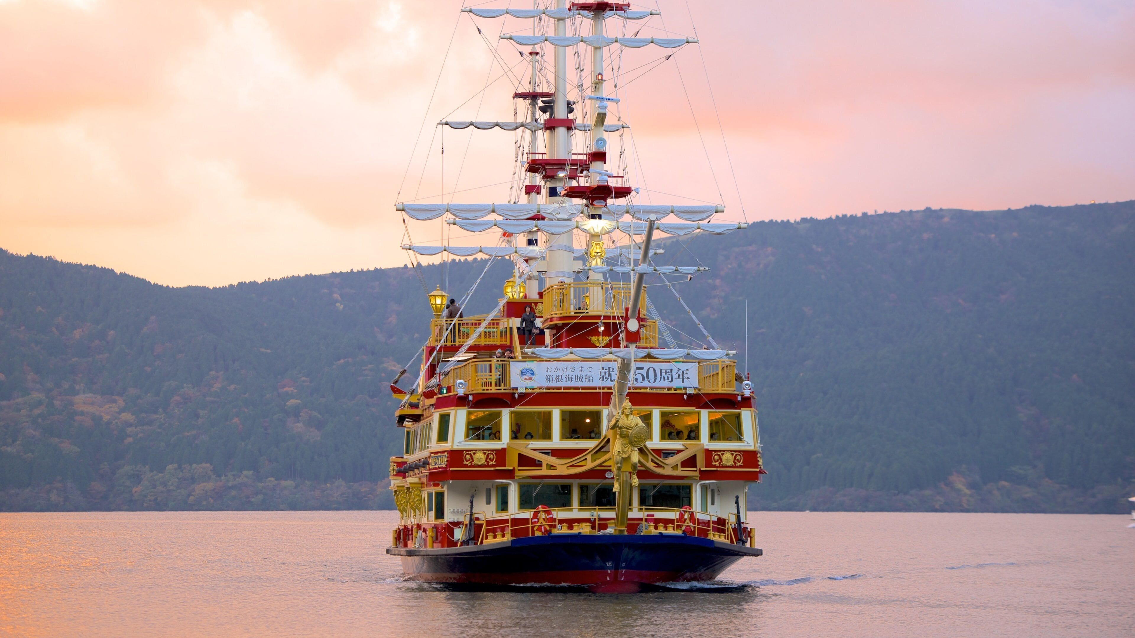 Lake Ashi which includes sailing, a lake or waterhole and a sunset