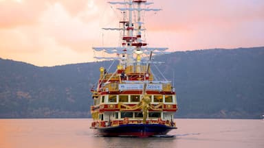 Lake Ashi which includes sailing, a lake or waterhole and a sunset