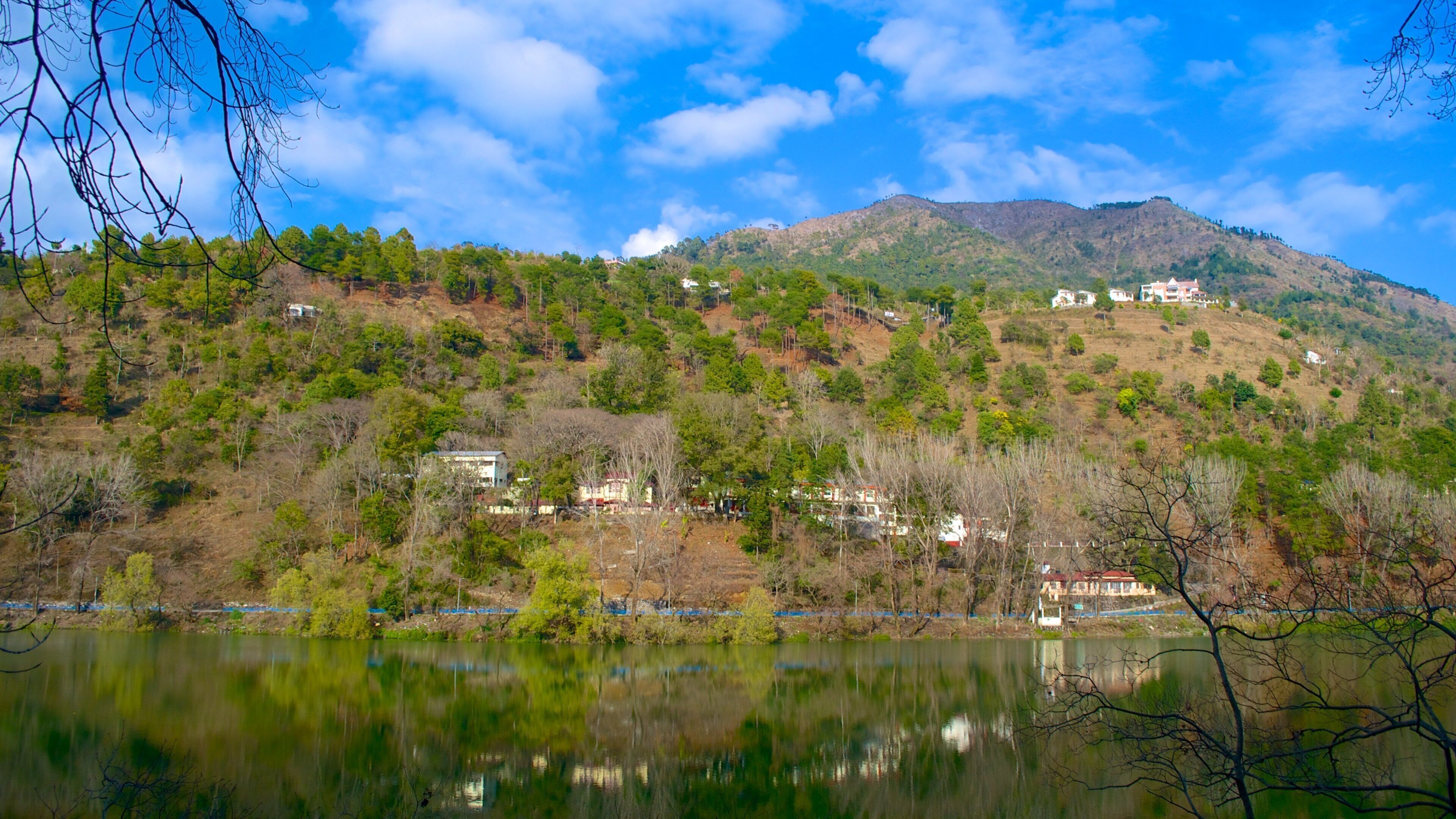 Bhimtal featuring mountains and a lake or waterhole