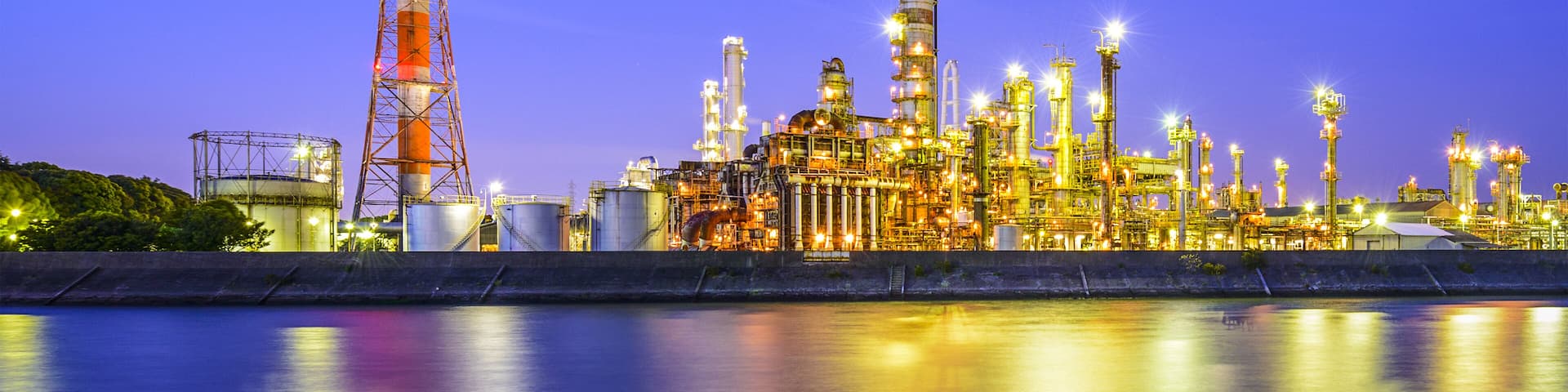 Oil refineries line a river in Yokkaichi, Japan. The city has been a center for the chemical industry since the 1930's.