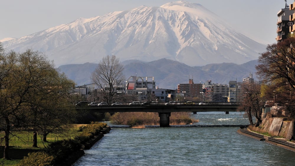 Mount Iwate and Kitakami River as seen from the Asahi bridge in Morioka, Iwate Prefecture, Japan.