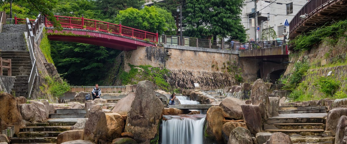 Arima Hot Springs which includes a garden and a river or creek