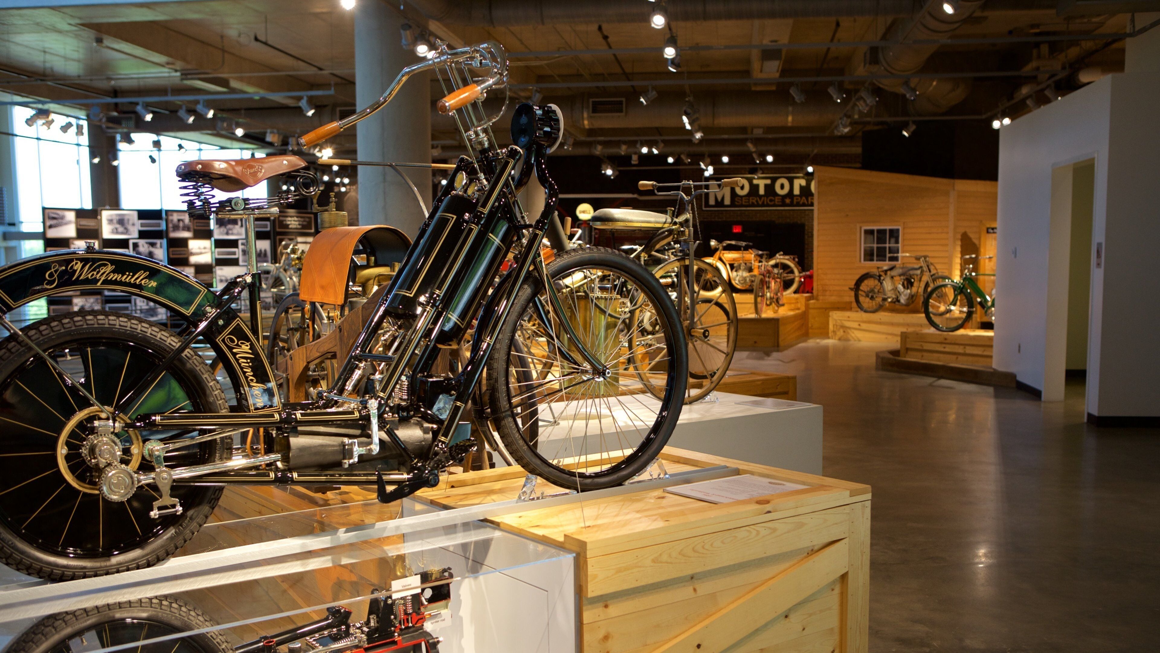 A vintage bicycle on display in a museum.
