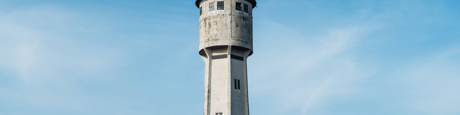 Old white tower blue sky