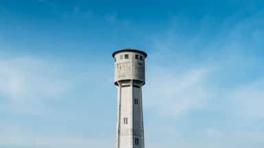 Old white tower blue sky