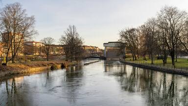 Trollhattan Midtown waterfront Old-fashioned Canal near Gota Alv river and hydroelectric Dam in Sweden during Late evening.