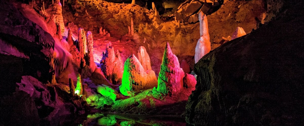 Forbidden Caverns is a charming cave in the Smokey Mountains, located not too far from Gatlinburg. The cave tour is enhanced by excellent mood lighting, which lends itself to excellent pictures. 
If you plan to take pictures, be sure to bring something to stabilize your camera. Also forget about using a flash, as it washes out the color and makes the image look flat.
#colorful