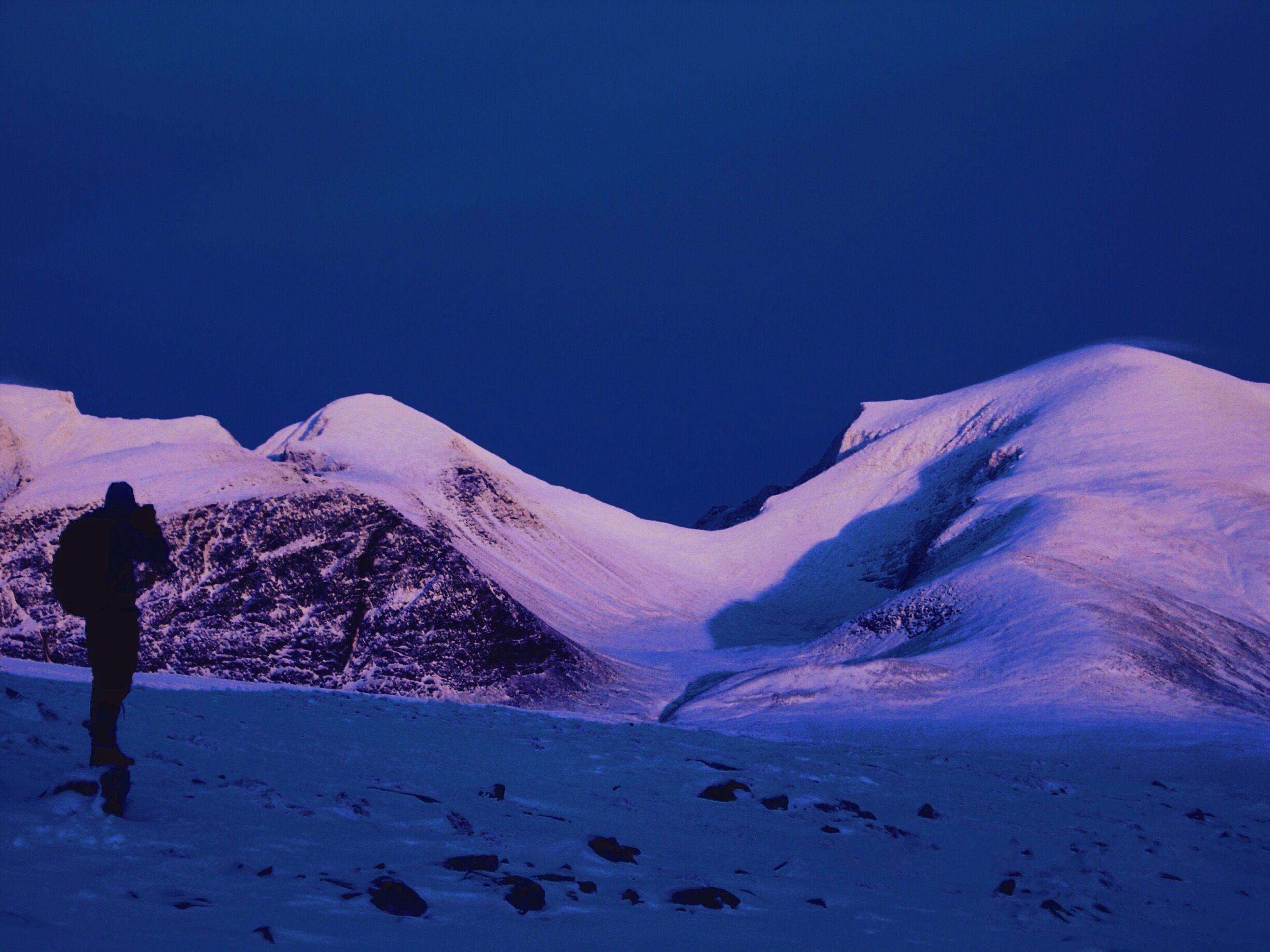 A photo taken a couple of years ago in the outskirts of Rondane National Park. We went there on foot in november and there was just little enough snow to still walk on foot. Got to experience this amazing light, with the sun settling in the west (behind us), and lighting up the central mountains in the area.