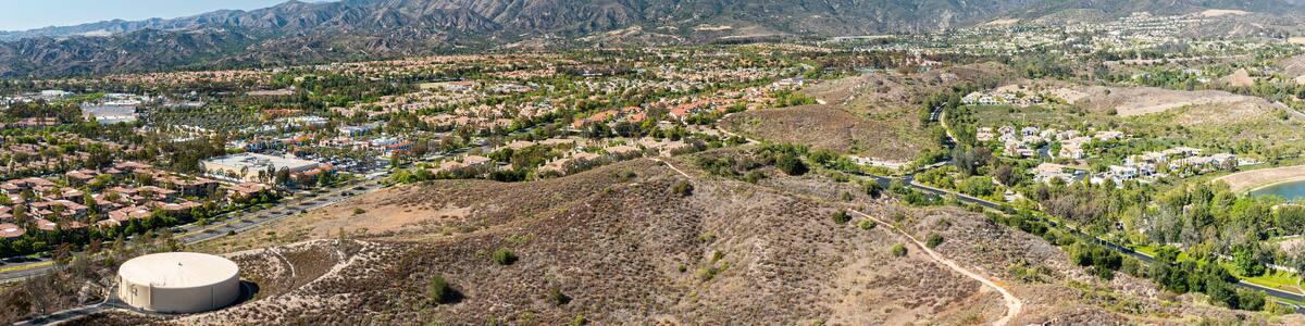 Aerial view of Rancho Santa Margarita showcasing suburban homes and Saddleback Mountains in Southern California