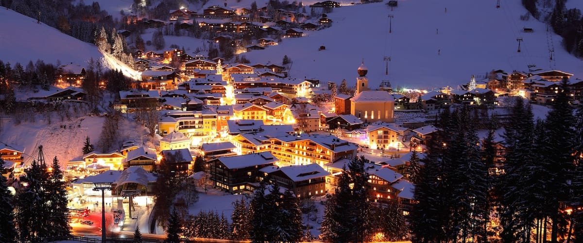 Saalbach-Hinterglemm Ski Resort which includes night scenes, a small town or village and snow