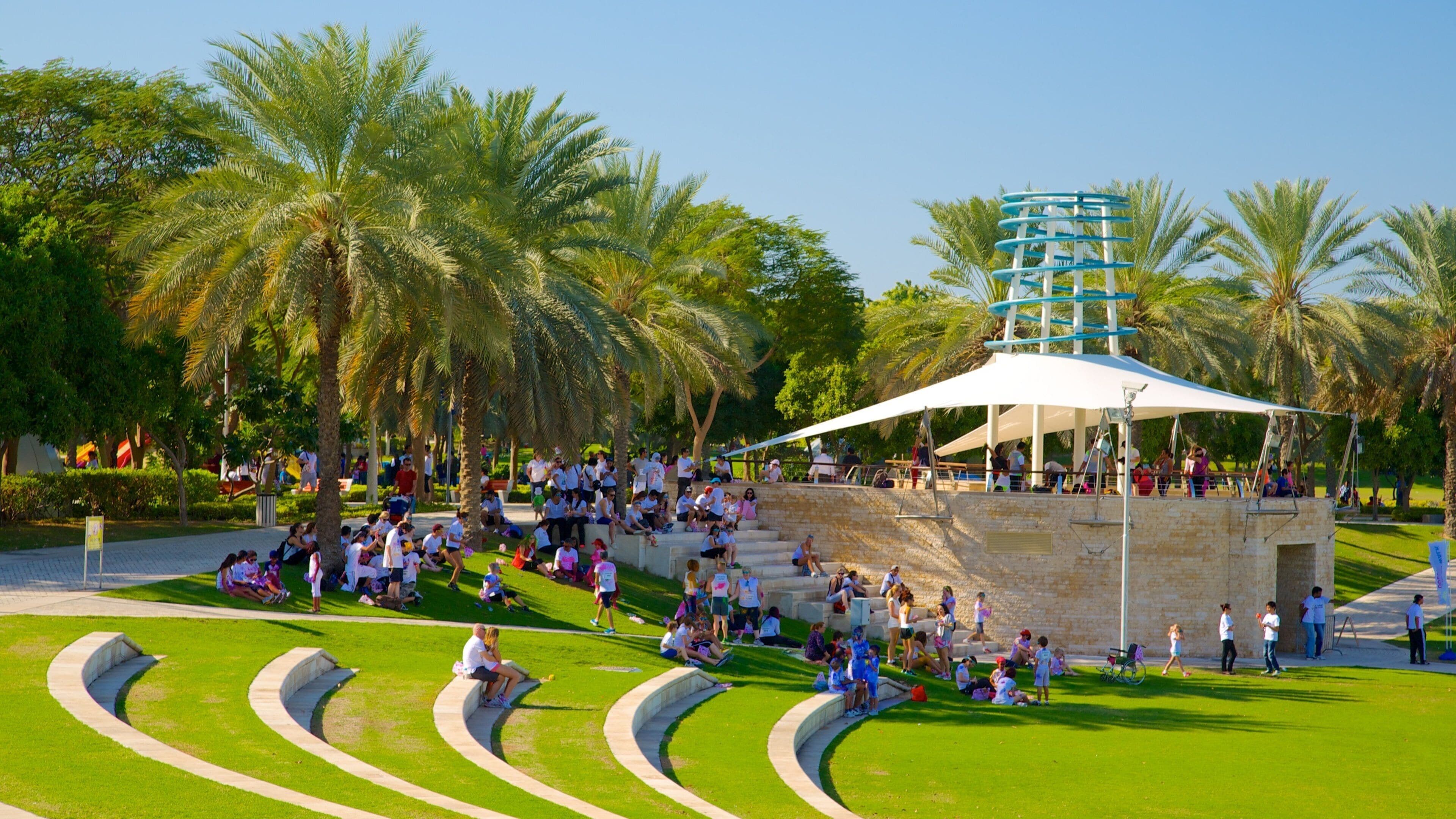 Zabeel Park featuring a park as well as a large group of people