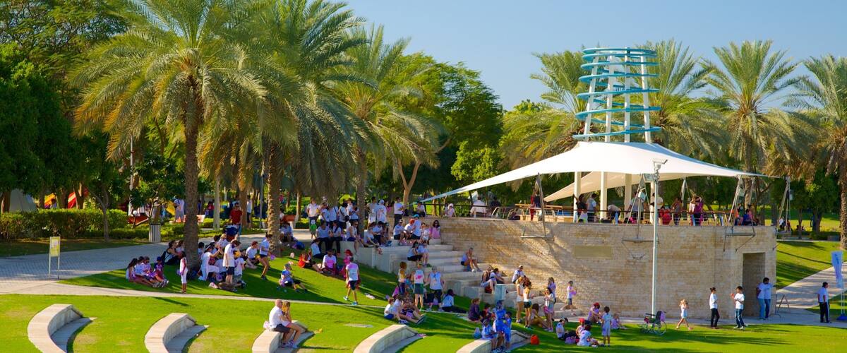 Zabeel Park which includes a garden as well as a large group of people