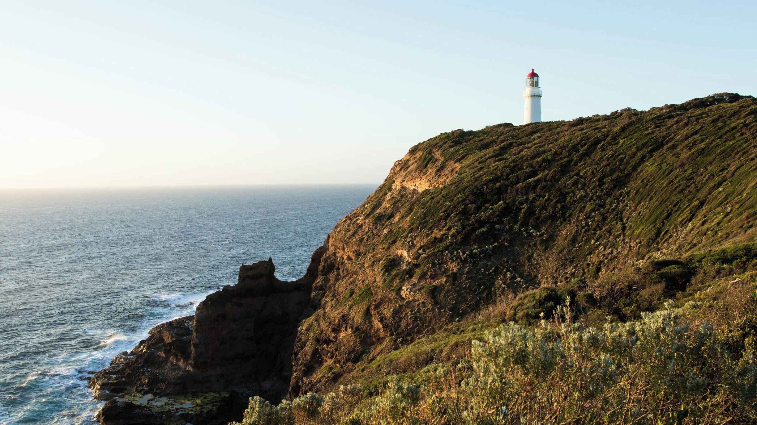 Sunset over Cape Schanck lighthouse which overlooks Bass Strait at the southernmost tip of the Mornington Peninsula. Cape Schanck is a rocky point, with limestone cliffs that has a historic lighthouse built in 1859 that still operates today.

