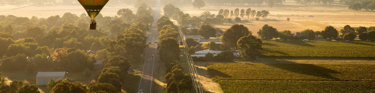 St Maarten and St Martin featuring landscape views, ballooning and a sunset