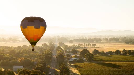 St Maarten and St Martin featuring landscape views, ballooning and a sunset