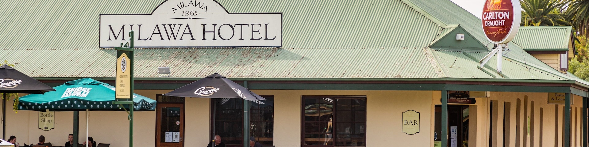 Milawa which includes a small town or village and signage