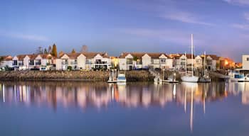Residential houses and sailboats moored on a peaceful bay at night, long exposure, Australia.