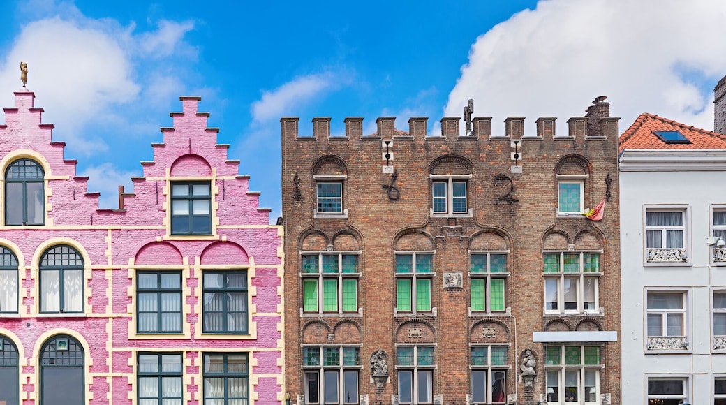 Traditional colorful Belgian facades of houses at Market square in city of Bruges.