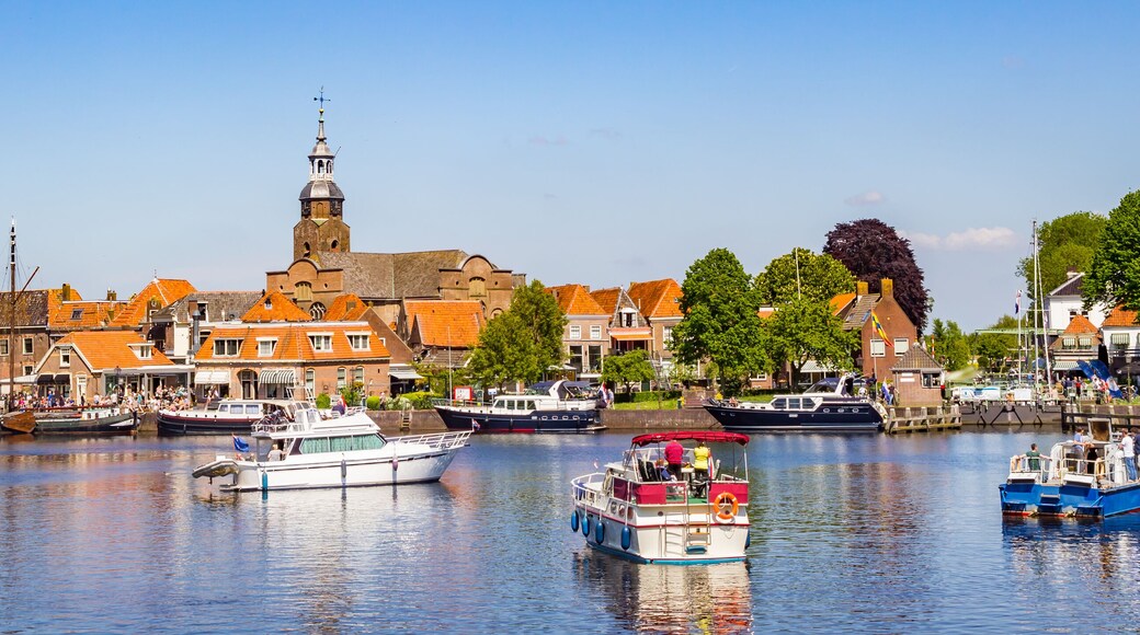 Panorama of historic village Blokzijl in summertime, with boats wating for the lock in the Netherlands