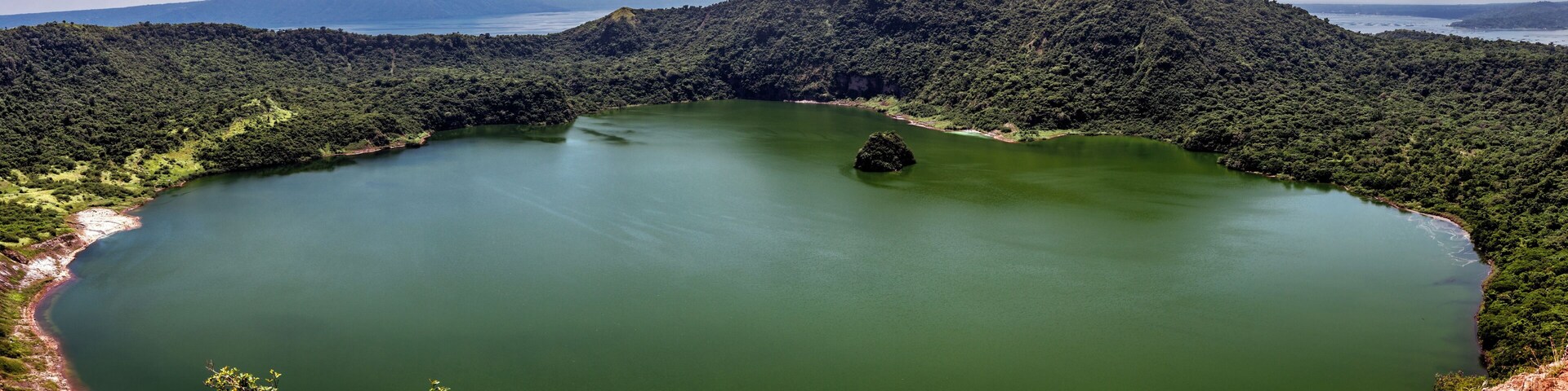 The Phillipines, once you leave Manila you are in a different world. Taal volcano is a popular day trip from Manila, it's supposed to be an easy hike but if you add hot weather plus hot steam and stuff from an active volcano it gets very difficult very fast, but don't worry they sell really expensive beer once you reach the top (trust me you will not care about the price and it will be delicious no matter what). Once you make it to the top the view is great, the crater has the smallest island on a volcano on an island in the world (or something like that) keep your gear light, you won't regret it.
#hiking #phillipines #taalvolcano