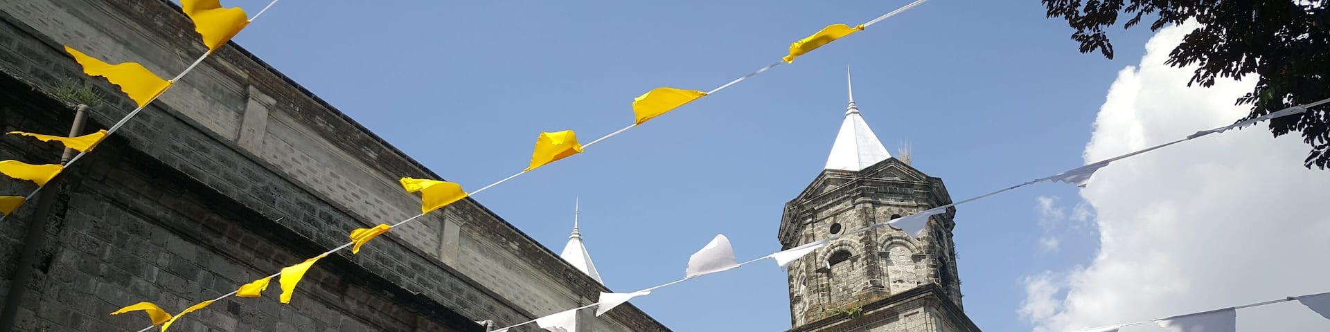 Colorfull flags at Santo Rosario church in Angeles, Philippines