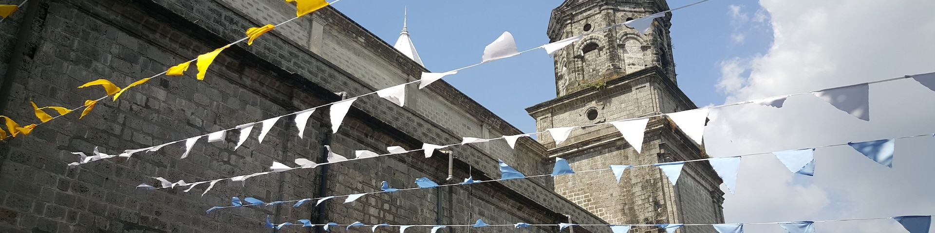 Colorfull flags at Santo Rosario church in Angeles, Philippines