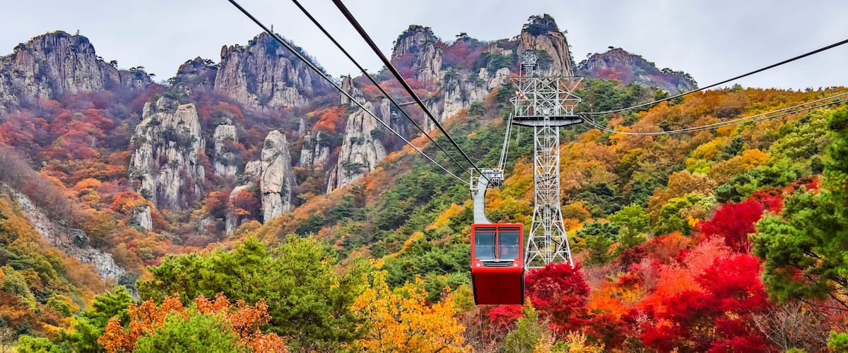 A cable car takes hikers and tourists up the mountain at Daedunsan Provincial Park, South Korea in autumn; Jeonbuk, Republic of Korea