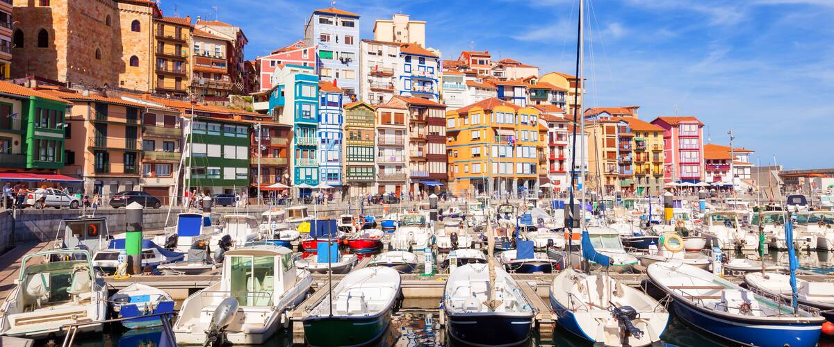 A harbor with colorful buildings and boats.